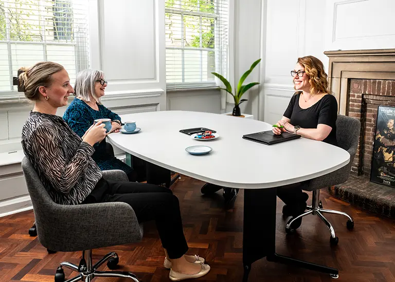 A solicitor gives advice to a mother and daughter