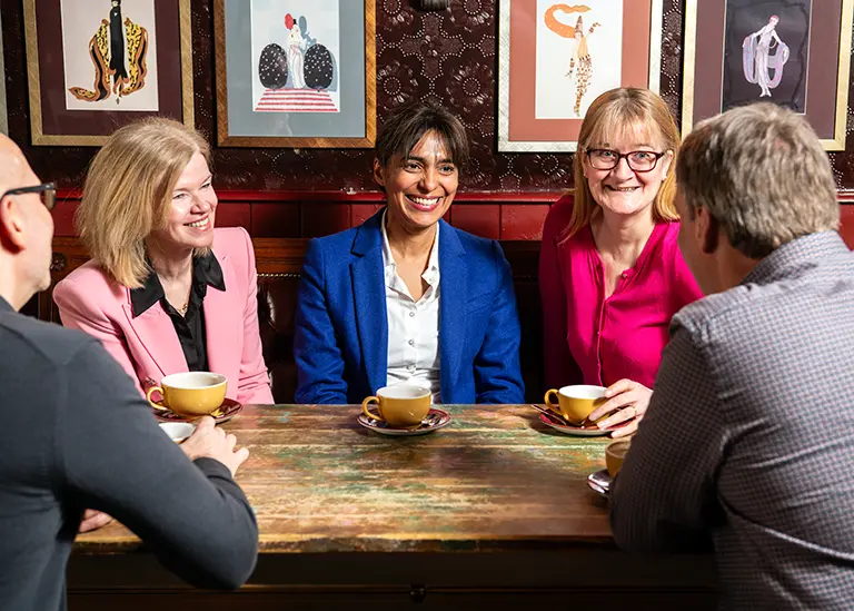 A divorcing couple involved in a mediation discussion