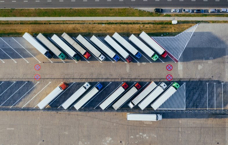 Aerial view of parked lorries.