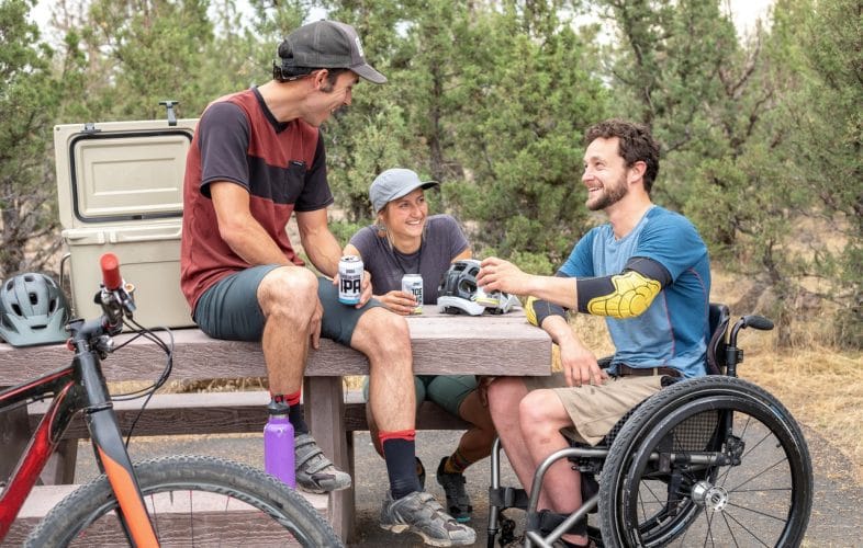 Man in wheelchair with friends